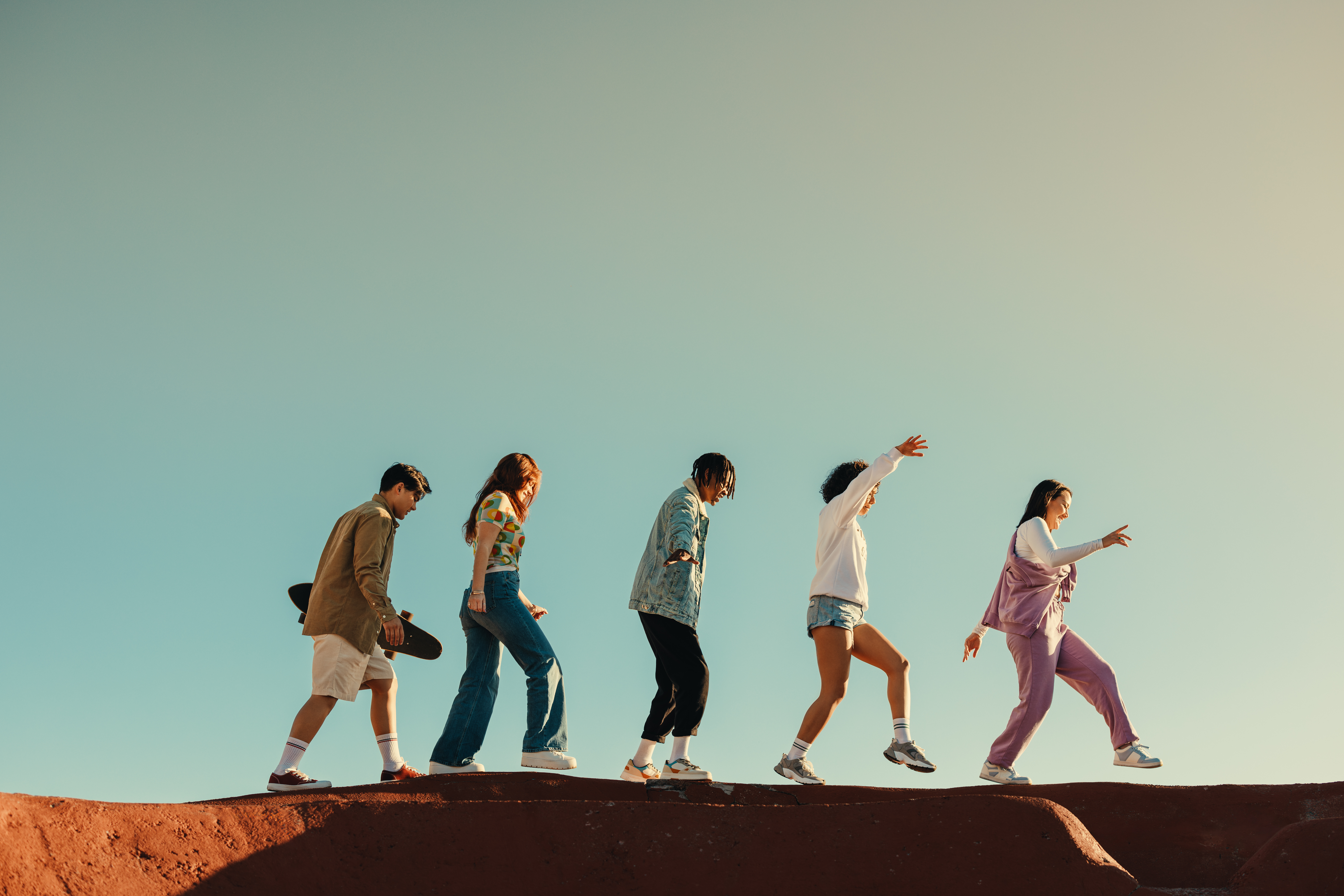 A group of friends traveling together, showcasing the joy and excitement of youth and adventure. The image includes ample copy space.